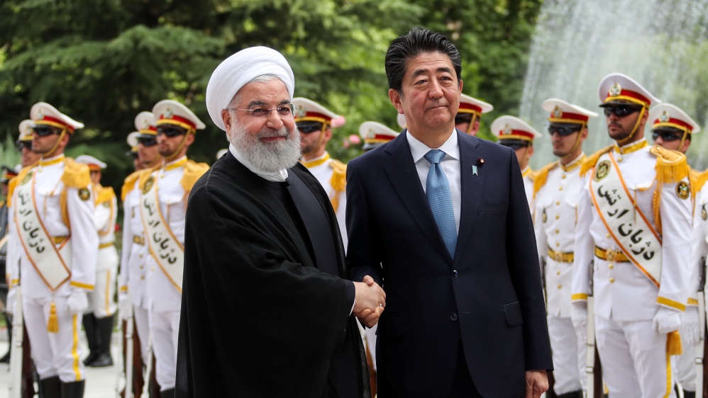 Iranian President Hassan Rouhani shakes hands with Japan''s Prime Minister Shinzo Abe, during a welcome ceremony in Tehran