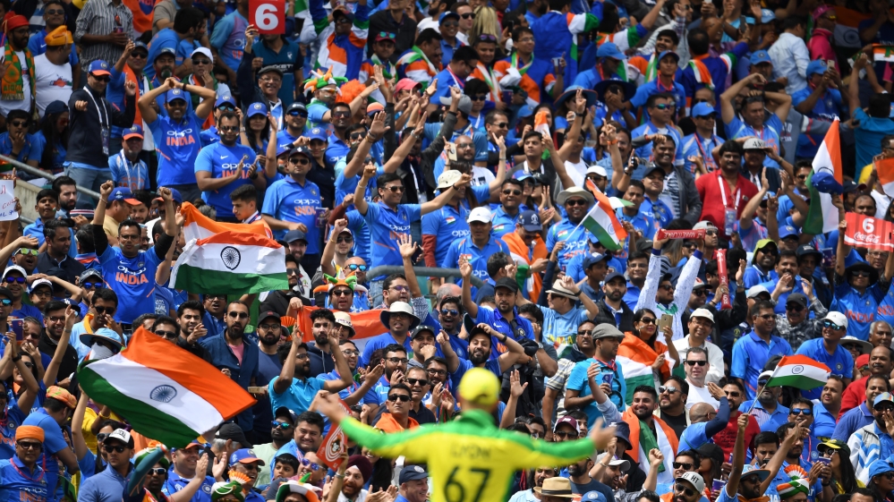 Indian supporters cheer during the 2019 Cricket World Cup group stage match between India and Australia at The Oval in London on June 9, 2019. Dibyangshu SARKAR / AFP