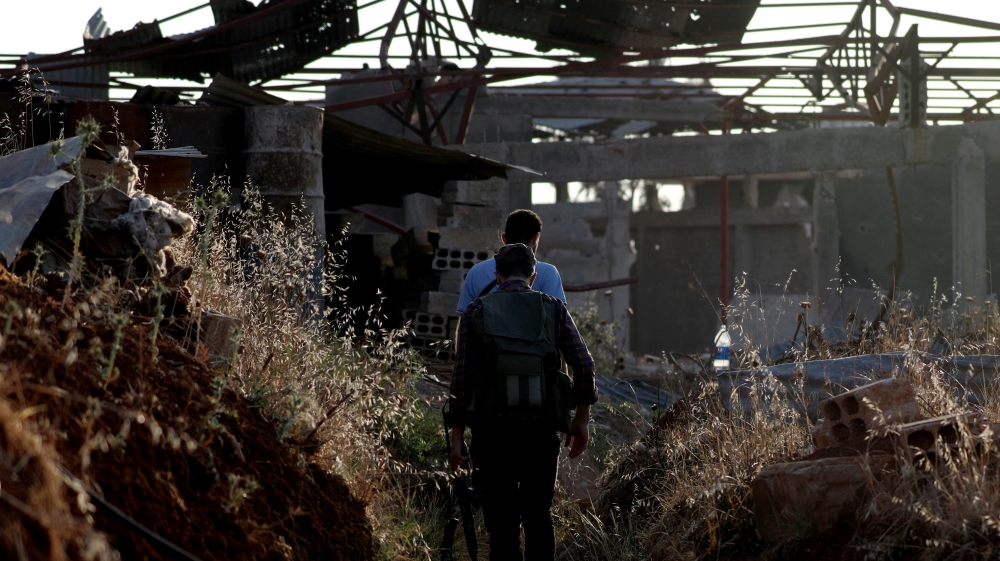 Fighters from the Free Syrian Army are seen in Yadouda area in Daraa