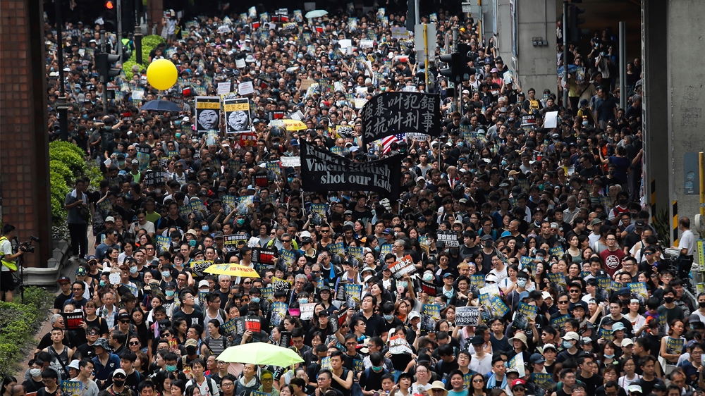 Protesters march through the Sha Tin District in Hong Kong, Sunday, July 14, 2019. Opponents of a proposed Hong Kong extradition law have begun a protest march, adding to an outpouring of complaints