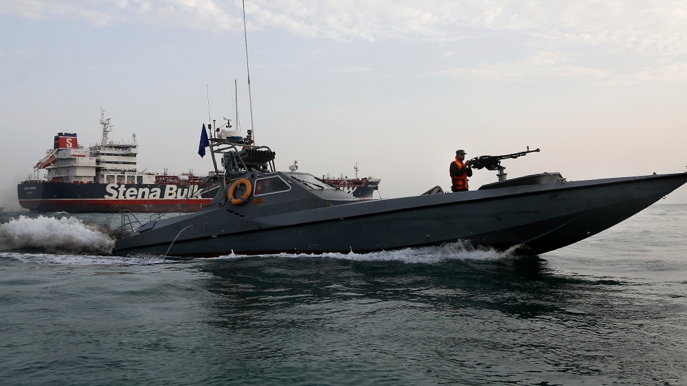 A speedboat of the Iran''s Revolutionary Guard moves around a British-flagged oil tanker Stena Impero, which was seized on Friday by the Guard, in the Iranian port of Bandar Abbas, Sunday, July 21, 201