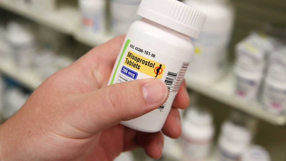 A pharmacist shows a bottle of the drug Misoprostol, made by Lupin Pharmaceuticals, at a pharmacy in Provo