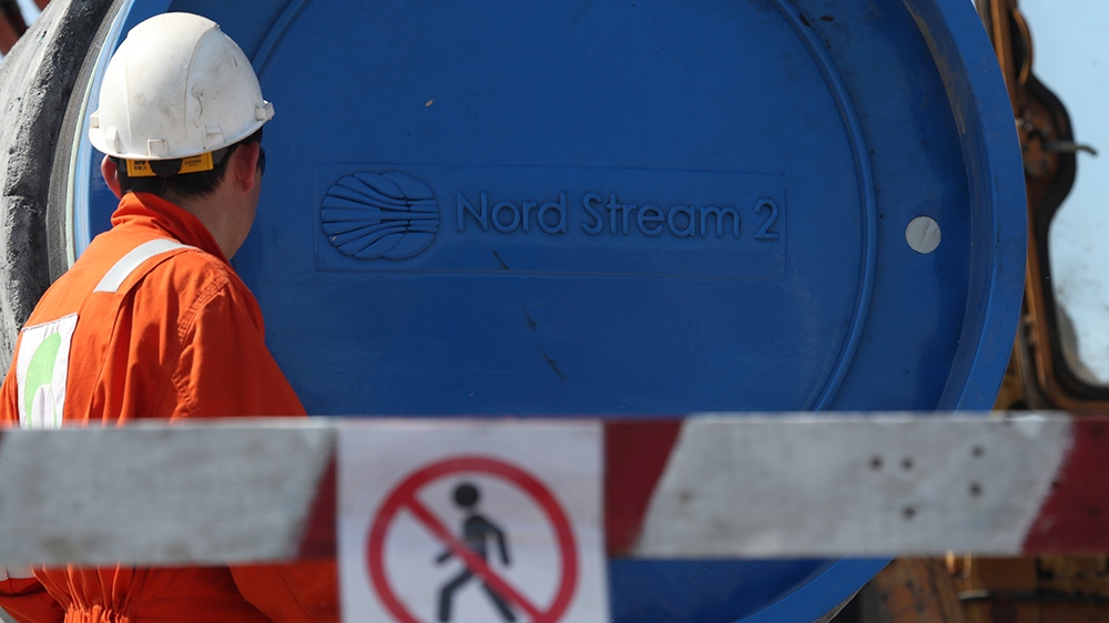 Worker near a pipe at Nord Stream pipeline site in Russia