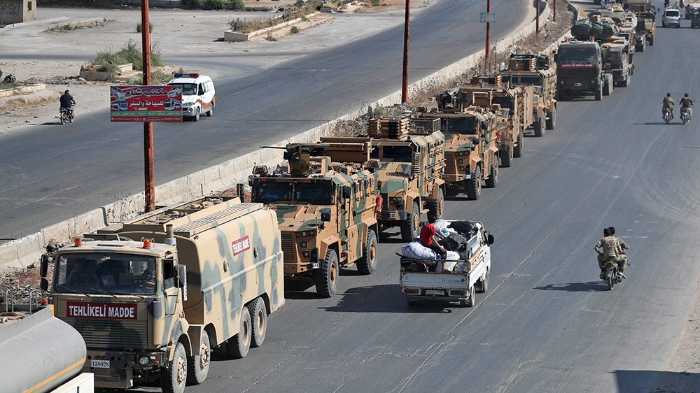 A convoy of Turkish military vehicles passes through Maaret al-Numan in Syria's northern province of Idlib reportedly heading toward the town of Khan Sheikhun in the southern countryside of the provin