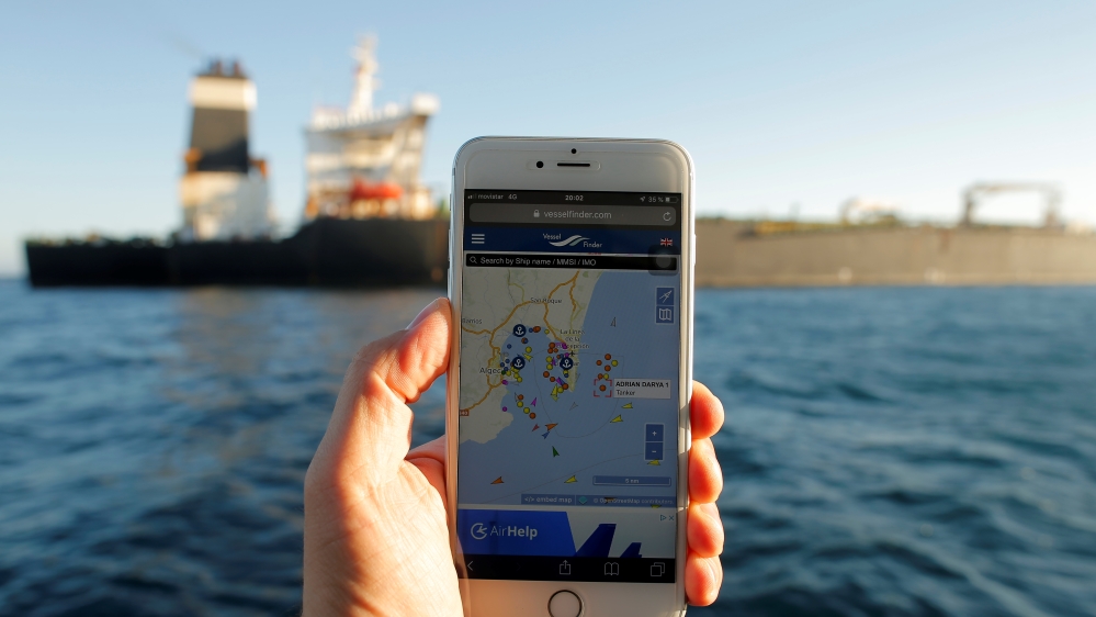 The position of the Iranian oil tanker Adrian Darya 1, formerly named Grace 1, is seen on a mobile phone as it sits anchored after the Supreme Court of the British territory lifted its detention or
