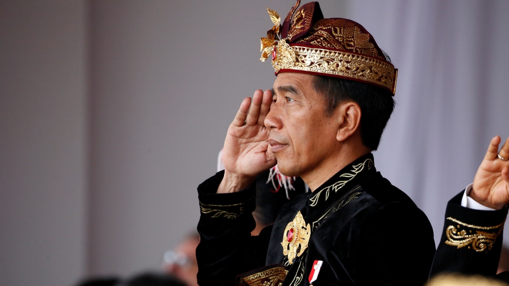 Indonesia President Joko Widodo and Indonesia Vice President Jusuf Kalla salute during a ceremony to celebrate Indonesia''s 74th Independence Day at the Presidential Palace in Jakarta