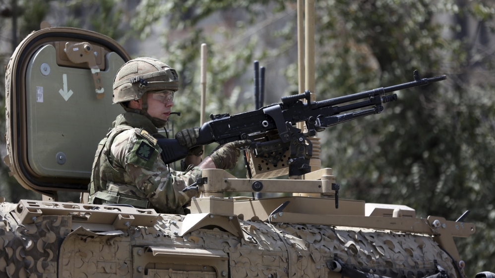Resolute Support (RS) forces guard at the site of a car bomb explosion in Kabul, Afghanistan, Thursday, Sept. 5, 2019