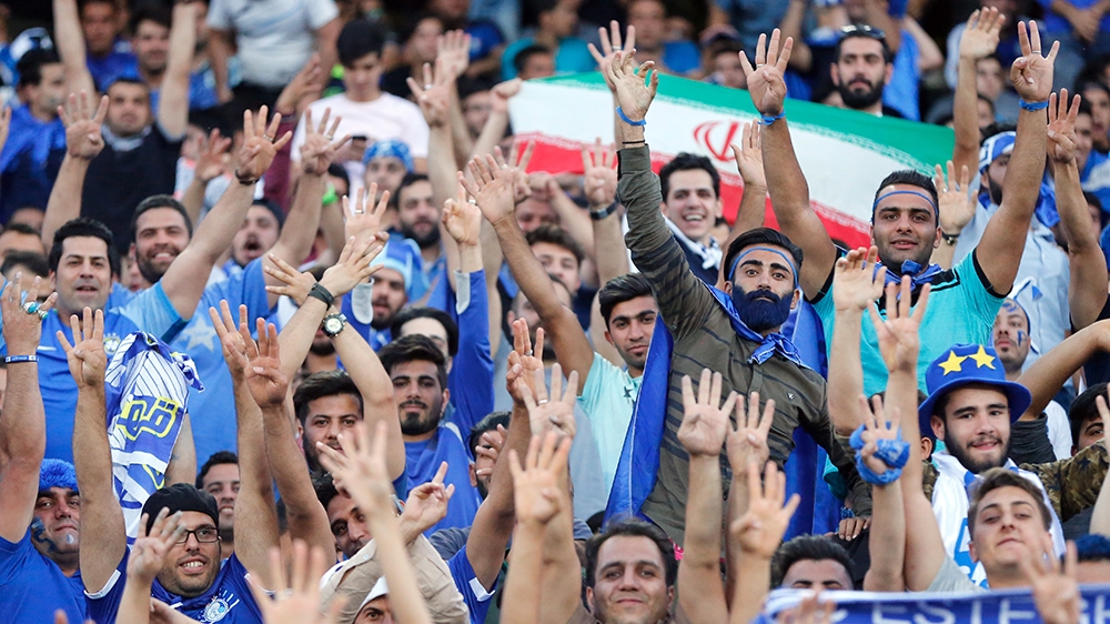 Esteghlal fans cheer during the AFC Champions League Round of 16 soccer match between Esteghlal FC and Al-Ain (UAE) FC at the Azadi Stadium in Tehran, Iran, 22 May 2017. EPA/ABEDIN TAHERKENAREH