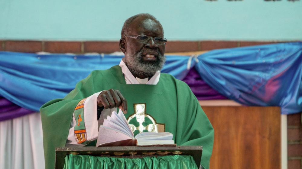Priest [Tendai Marima/Al Jazeera]
