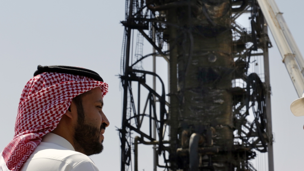 n this photo opportunity during a trip organized by Saudi information ministry, a man watches the damaged in the Aramco''s Khurais oil field, Saudi Arabia, Friday, Sept. 20, 2019