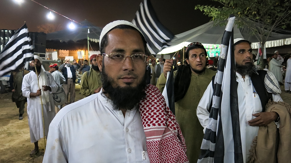Mustafa, 33, who goes by only one name, says he is marching against the government due to spiralling prices of daily commodities [Asad Hashim/Al Jazeera]