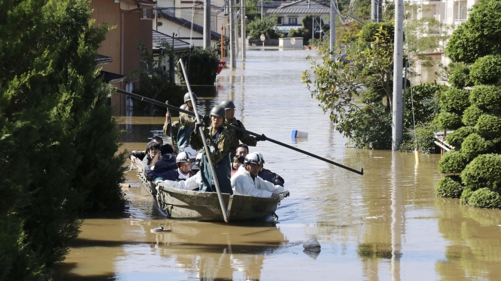 Local residents are rescued by Japapnese Defence-Force soldiers from a flooded area caused by Typhoon Hagibis in Kakuda