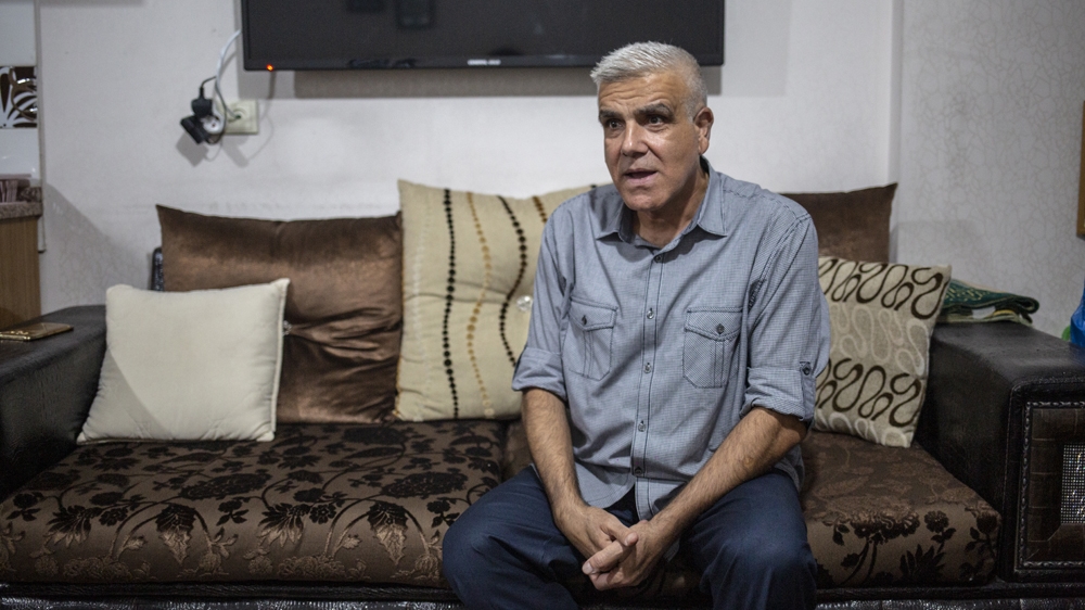 Ibrahim Jaddou speaks as he sits in his living room in Turkey's Sanliurfa