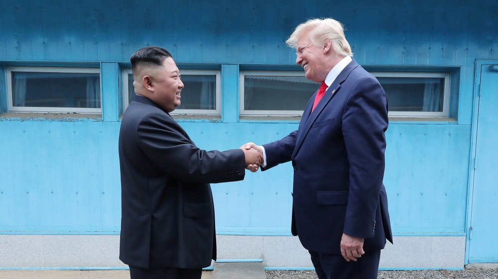 U.S. President Donald Trump shakes hands with North Korean leader Kim Jong Un as they meet at the demilitarized zone separating the two Koreas, in Panmunjom, South Korea, June 30, 2019. KCNA via REUTE