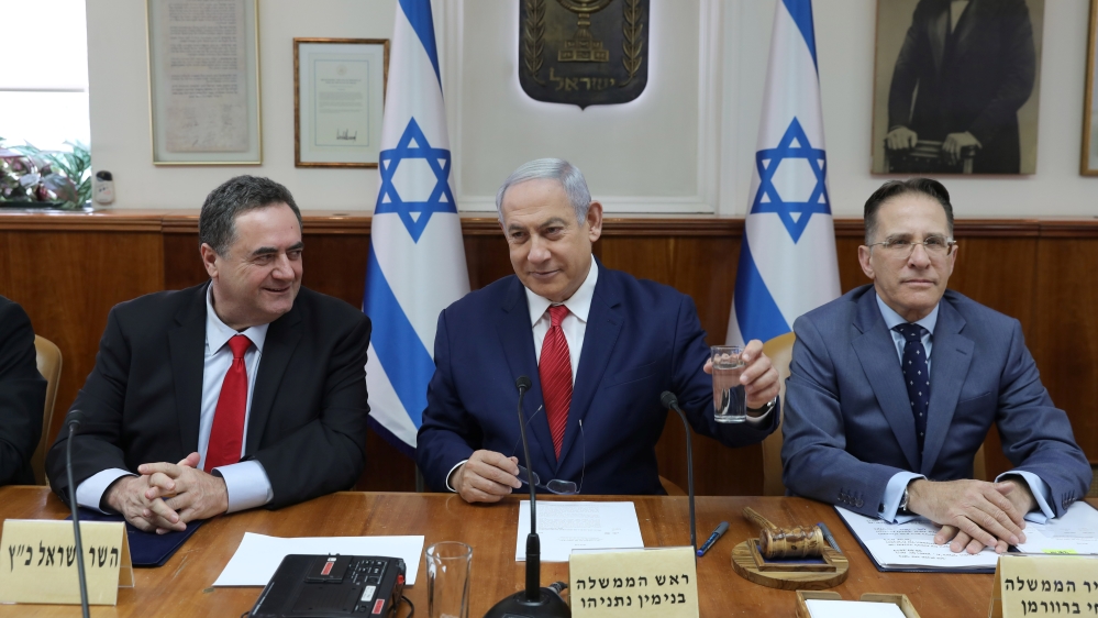 Israeli Prime Minister Benjamin Netanyahu, Foreign Minister Israel Katz and Government Secretary Tzachi Braverman attend the weekly cabinet meeting in Jerusalem