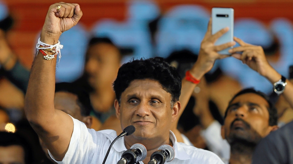 Sajith Premadasa, Sri Lanka''s Housing Minister and the presidential candidate of the United National Party (UNP)-led New Democratic Front gestures at his supporters during his first election campaign