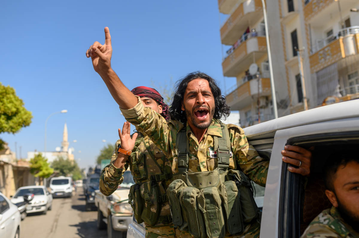 Turkey-backed Syrian opposition fighters going to Tel Abyad from Turkish gate towards Syria in Akcakale in Sanliurfa province on October 10, 2019. Turkey has launched a broad assault on Kurdish-contro