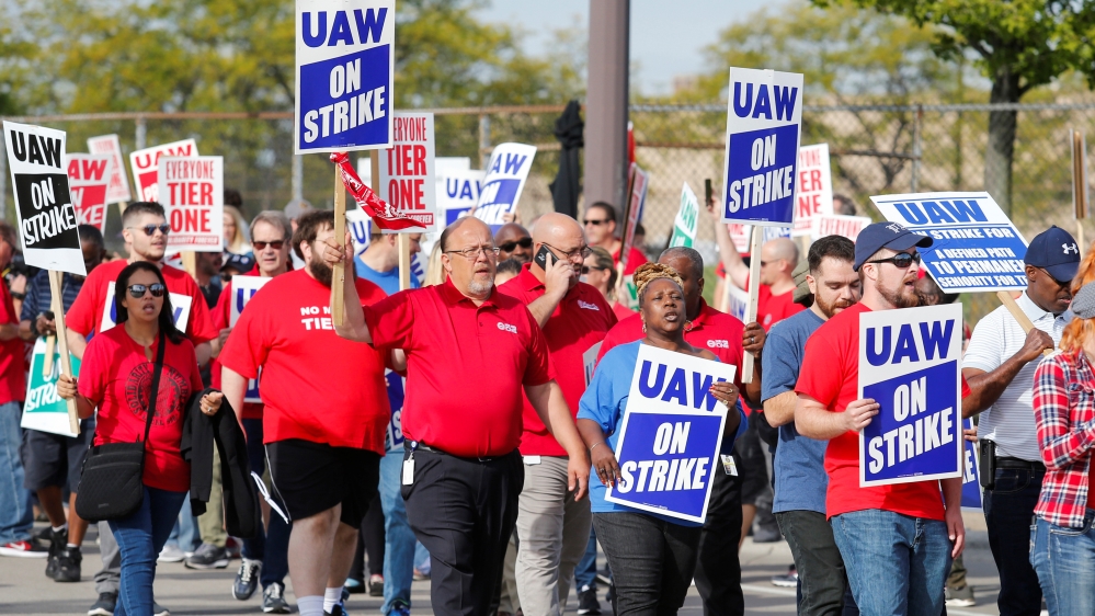Striking United Auto Workers (UAW) walk the picket line in Hamtramck