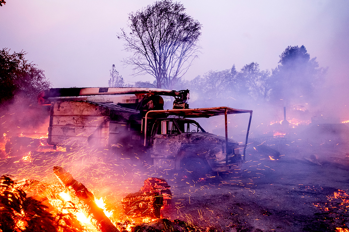 Flames from the Kincade Fire consume a truck in Healdsburg, Calif., on Sunday, Oct 27, 2019. (AP Photo/Noah Berger)