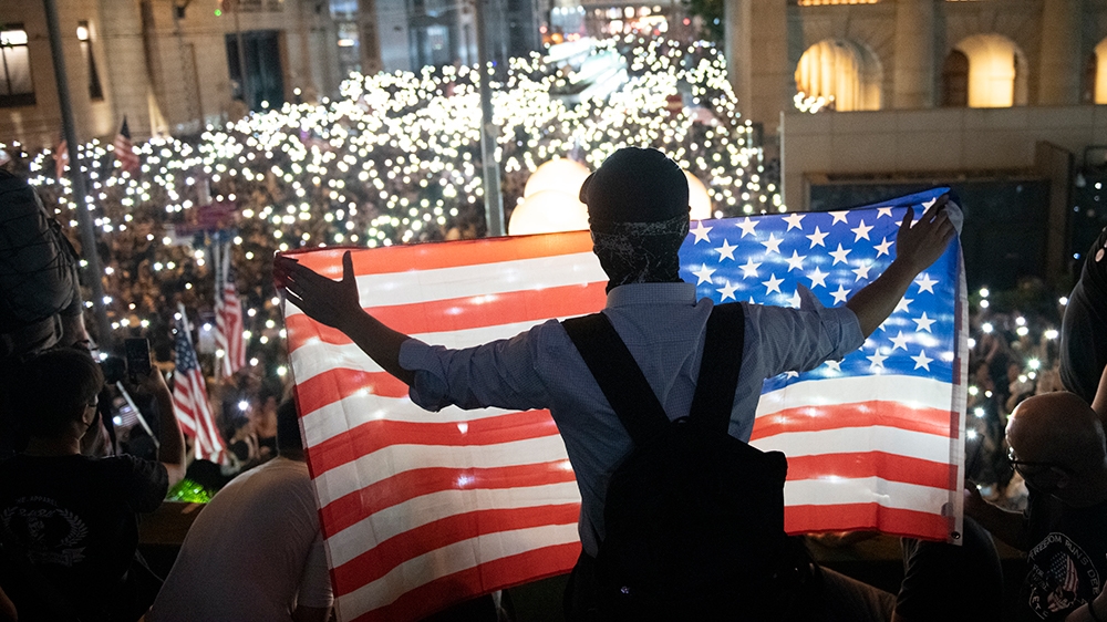 A protester are seen holding up an American Flag during a Rally in Hong Kong, China, October 14, 2019. Protesters gathered in the city''s central district in a police-sanctioned rally in support of th