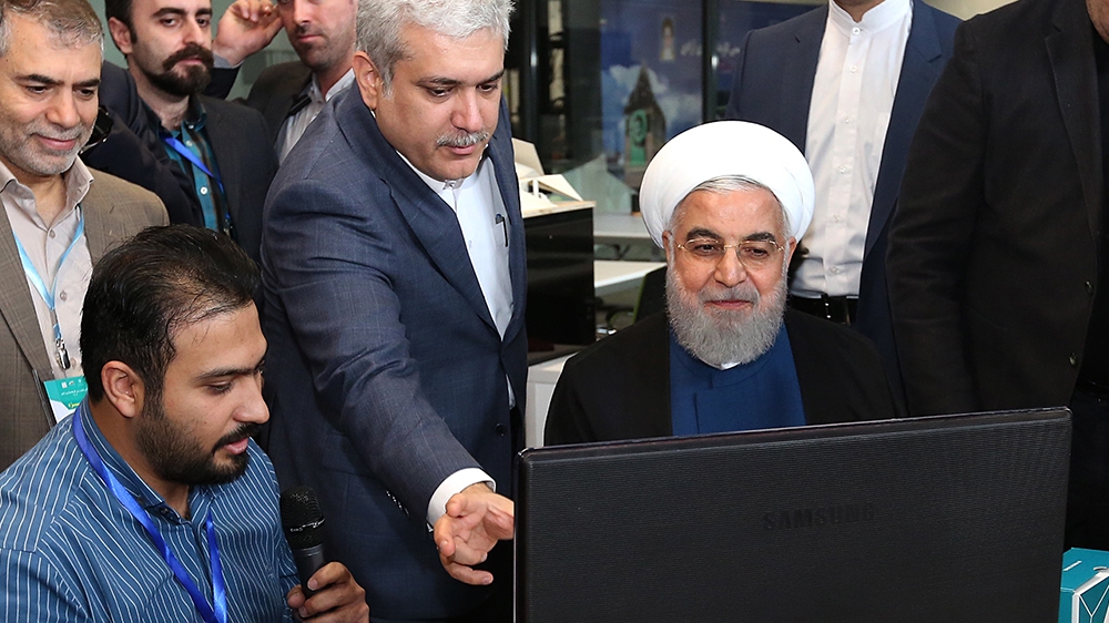 A handout photo made available by the Iranian Presidential Office shows Iranian President Hassan Rouhani (C) visiting a Noavari factory in Tehran, Iran, 05 November 2019. According to media reports, R