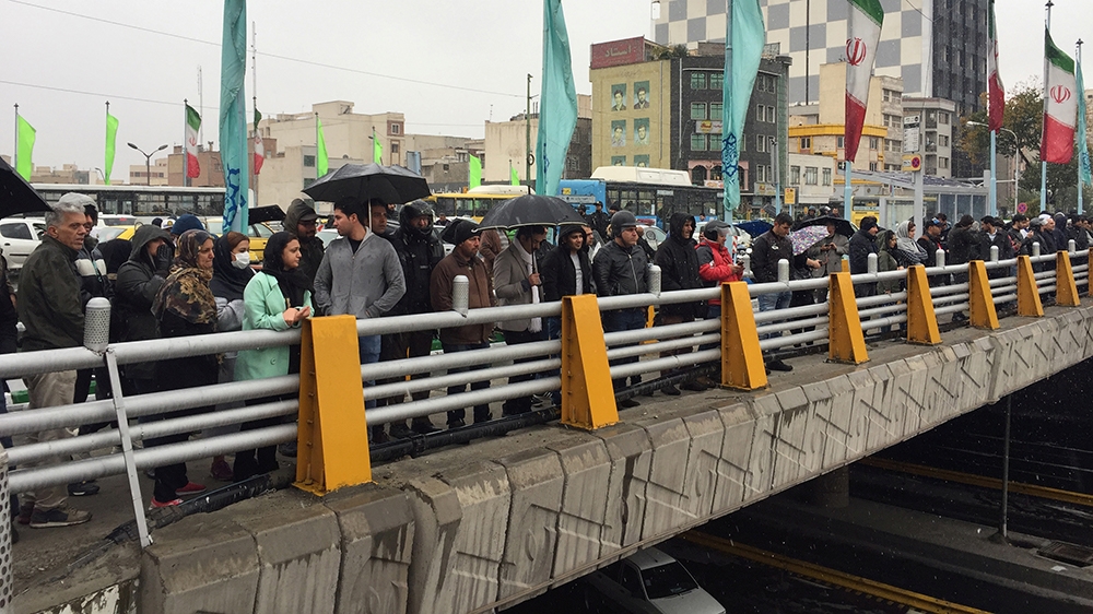 People stands in the street to show their protest against increased gas price in Tehran, Iran November 16, 2019. Nazanin Tabatabaee/WANA (West Asia News Agency)