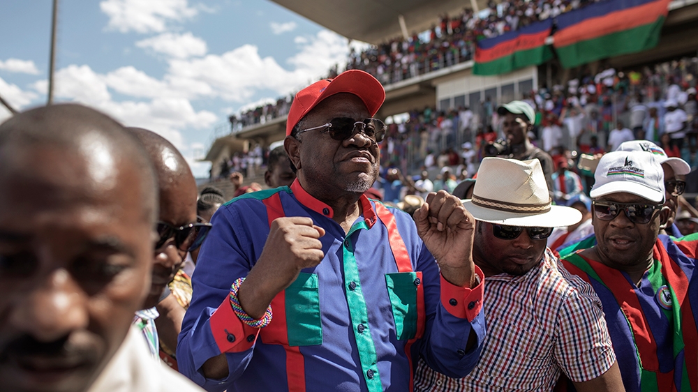 Namibian current President and Namibian ruling party South West Africa People''s Organisation (SWAPO) Presidential candidate Hage Gottfried Geingob (C) arrives to address the final Namibian General ele