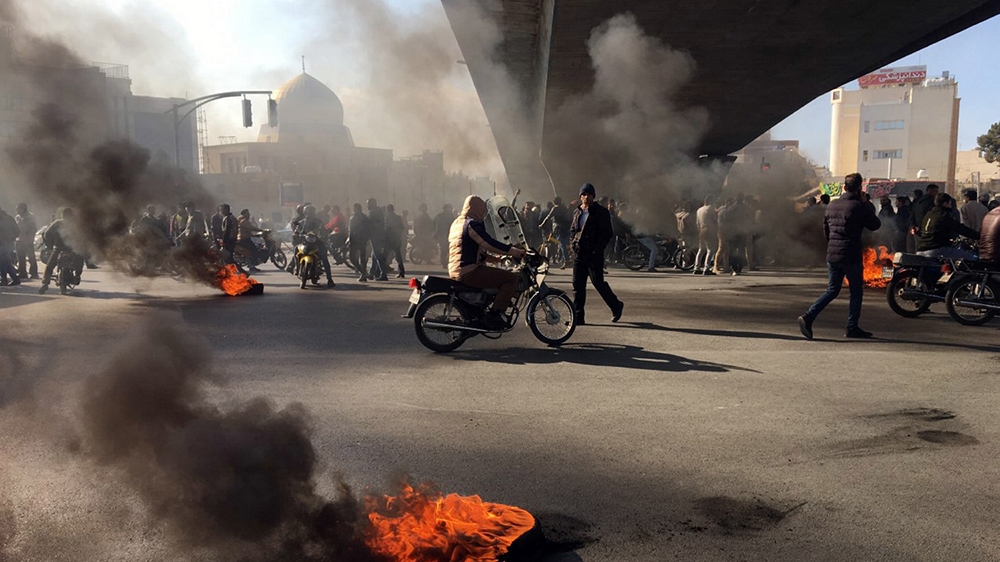 This is to amend image epa08002047 issued on 16 November 2019, correcting CITY to Isfahan (not: Tehran). The revised caption reads: Iranian protesters block a highway following fuel price increase i