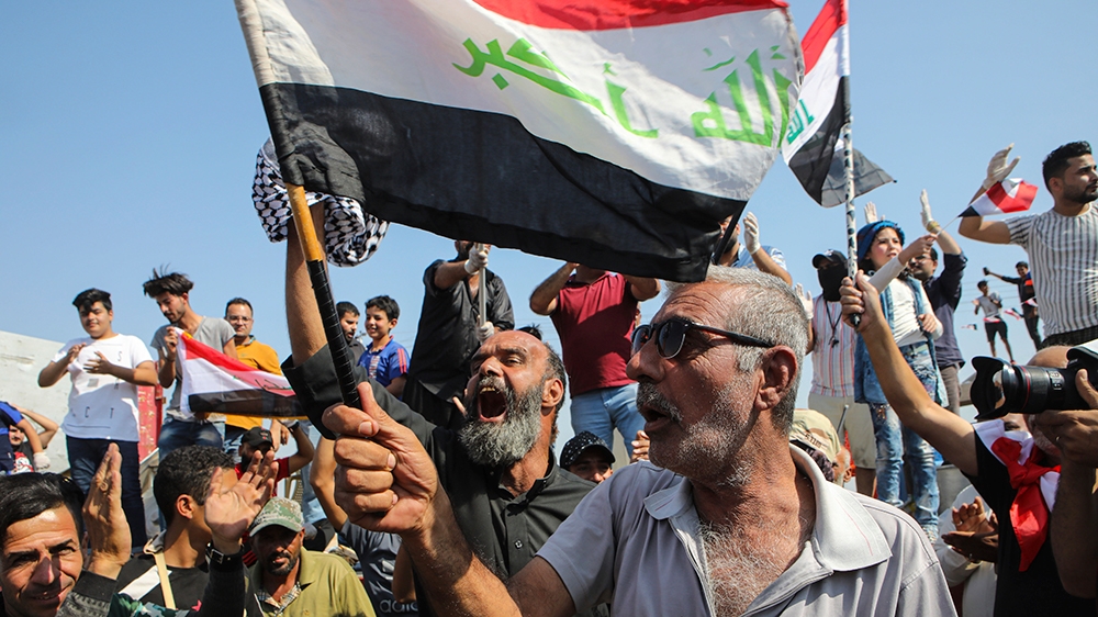 Anti-government protesters block the port of Umm Qasr, a day after clashes between security forces, and protesters, during ongoing demonstrations, in Basra, Iraq, Sunday, Nov. 3, 2019. (AP Photo/Nabil