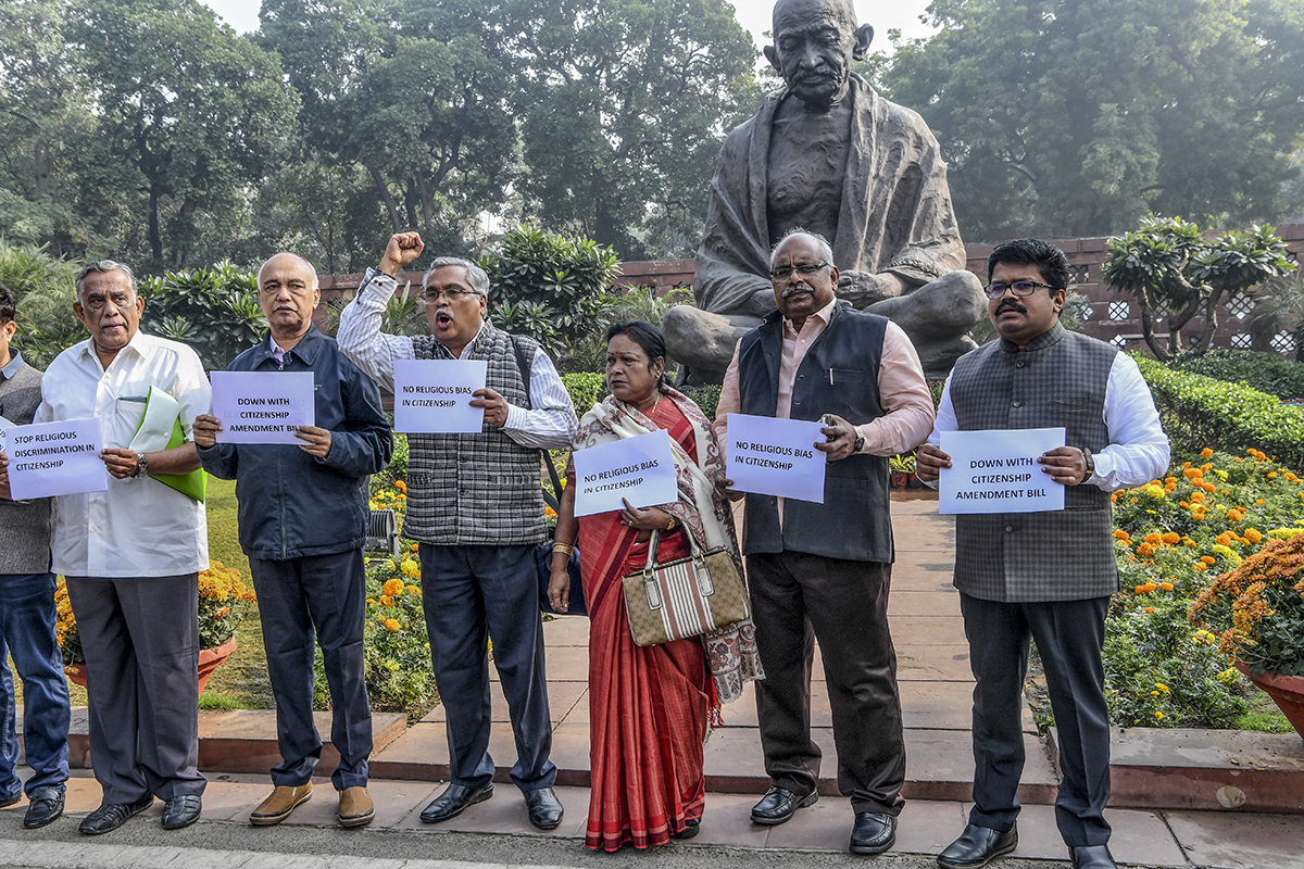 Members of Parliament (MP) from left parties shout slogans against the government''s Citizenship Amendment Bill (CAB) at the Parliament House in New Delhi on December 10, 2019. Prakash SINGH / AFP
