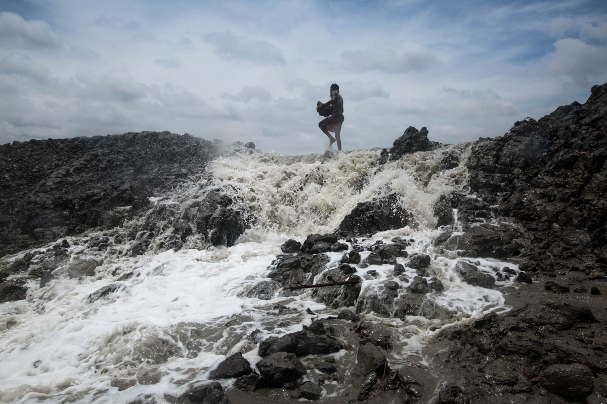 Mojid, 55, trying to repair the riverbank just cyclone Fani hits in the coastal area of Khulna District. He said that he has lost his house 4 times during he taking care of his family and he is witnes