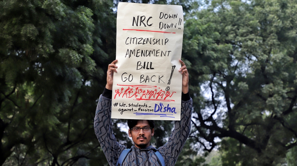 A boy holds a placard as they protest against the Citizenship amendment bill and National Register of Citizens (NRC) in New Delhi, India on 07 December 2019 (Photo by Nasir Kachroo/NurPhoto via Getty