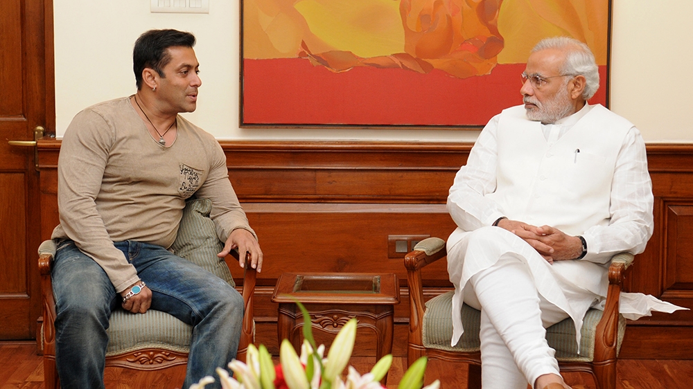 In this handout photograph released on November 7, 2014, Indian Prime Minister Narendra Modi (R) speaks with Bollywood actor Salman Khan during a meeting in New Delhi on November 6, 2014. [Handout/AFP