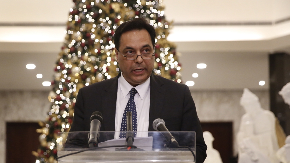 Newly-assigned Lebanese Prime Minister, Hassan Diab, speaks to journalists after his meeting with Lebanese President Michel Aoun at the presidential palace, in Baabda, east of Beirut, Lebanon, Thursda