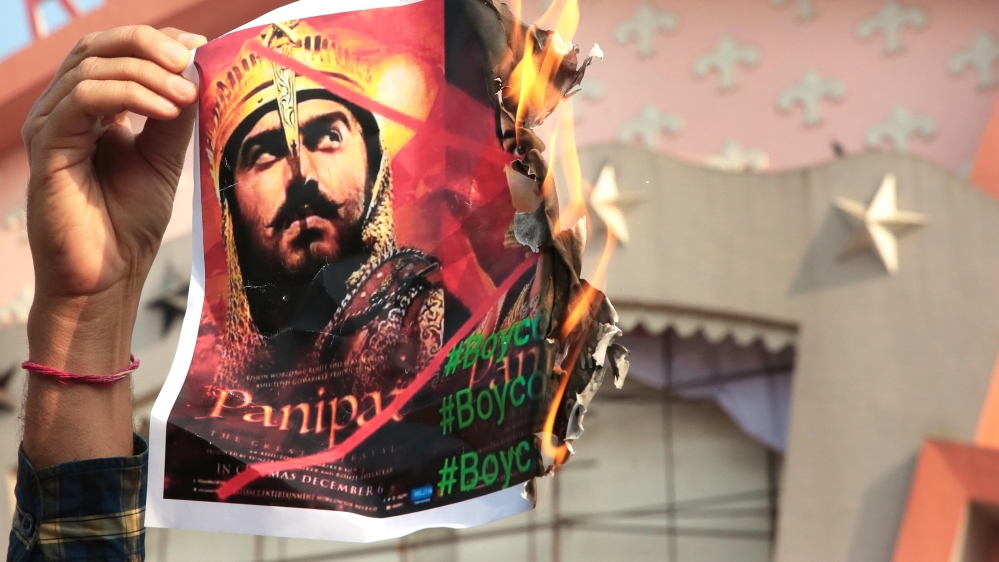 Rashtriya Loktantrik Party and members of the Jat community burn posters and protest against the movie Panipat outside Raj Mandir, a prominent city movie theater on December 9, 2019 in Jaipur, India.