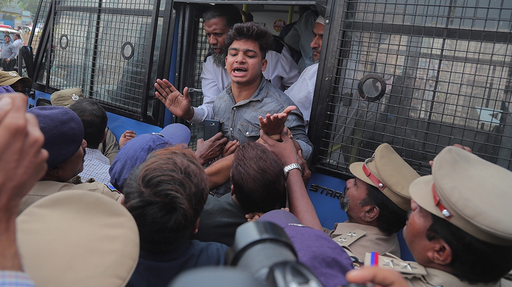 A protestor shouts slogans after being detained by police in Hyderabad, India, Thursday, Dec. 19, 2019. Police detained several hundred protestors in some of India's biggest cities Thursday as they de