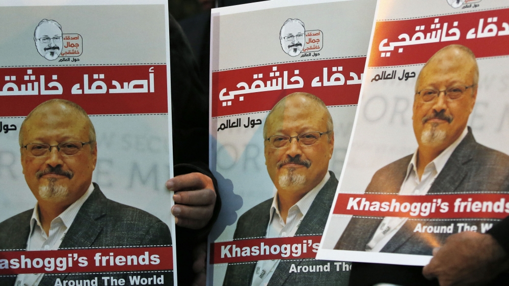Activists protesting the killing of Saudi journalist Jamal Khashoggi hold a candlelight vigil outside Saudi Arabia''s consulate in Istanbul, Thursday, Oct. 25, 2018. The posters read in Arabic:'' Khas