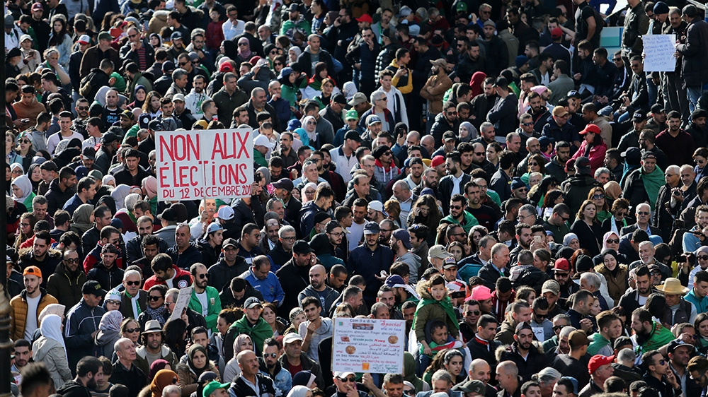 Demonstrators shout slogans during a protest to reject the presidential election in Algiers, Algeria December 12, 2019. REUTERS/Ramzi Boudina