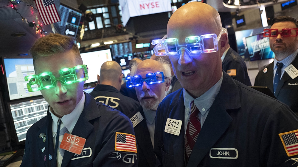 Stock traders wear New Year''s 2020 party glasses at New York Stock Exchange, Tuesday, Dec. 31, 2019