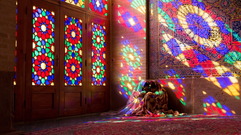 Iranian young women sit on a floor of Nasir al-Mulk Mosque, called the Pink Mosque as well, in Shiraz, Iran, September 15, 2018. (Photo by Dominika Zarzycka/NurPhoto via Getty Images)