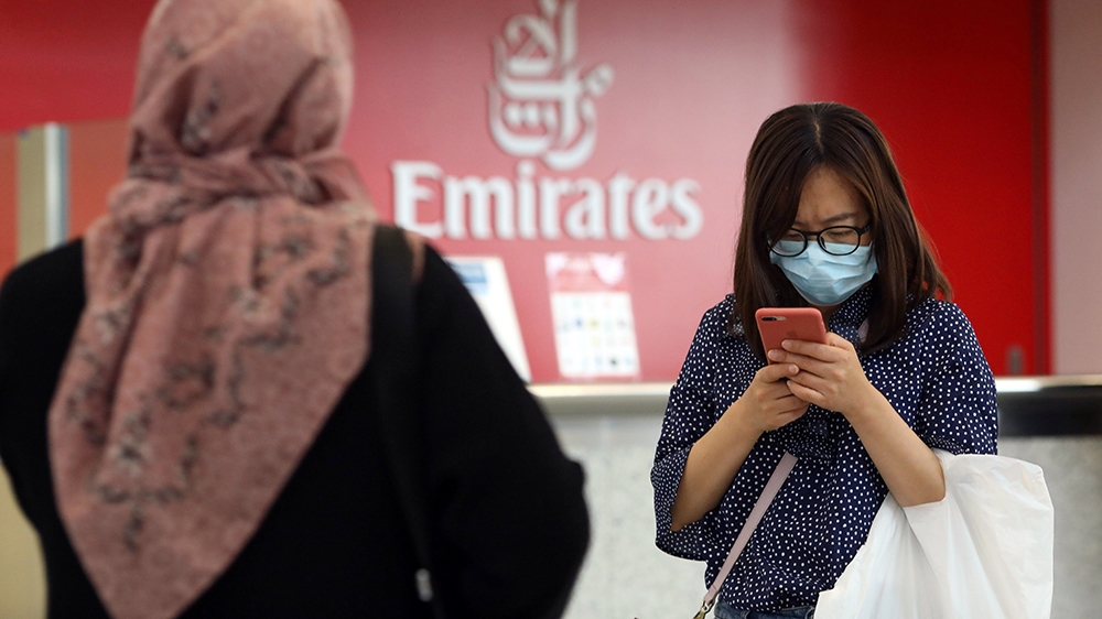 A traveller wears a mask at the Dubai International Airport, after the UAE''s Ministry of Health and Community Prevention confirmed the country''s first case of coronavirus, in Dubai, United Arab Emirat