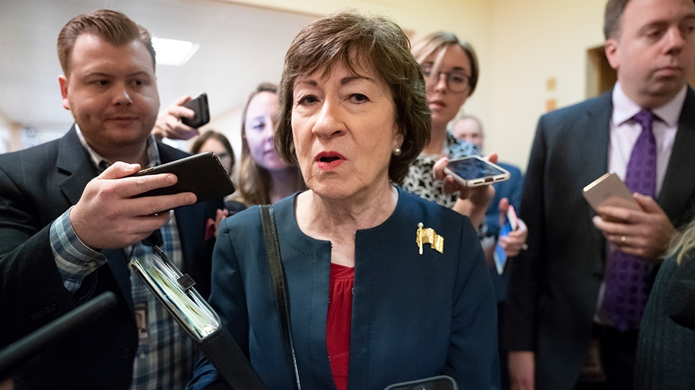 Sen. Susan Collins, R-Maine, is surrounded by reporters as she rushes to a vote at the Capitol in Washington, Wednesday, Nov. 6, 2019. (AP Photo/J. Scott Applewhite)