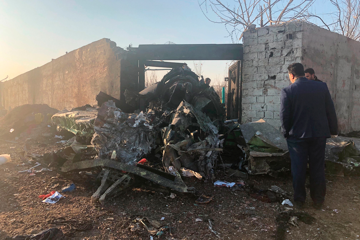 Debris is seen from a plane crash on the outskirts of Tehran, Iran, Wednesday, Jan. 8, 2020. A Ukrainian airplane carrying at least 170 people crashed on Wednesday shortly after takeoff from Tehran’s