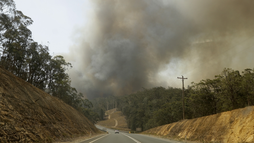Smoke from a fire at Batemans Bay, Australia, billows into the air, Saturday, Jan. 4, 2020. Australia''s prime minister called up about 3,000 reservists as the threat of wildfires escalated in at least
