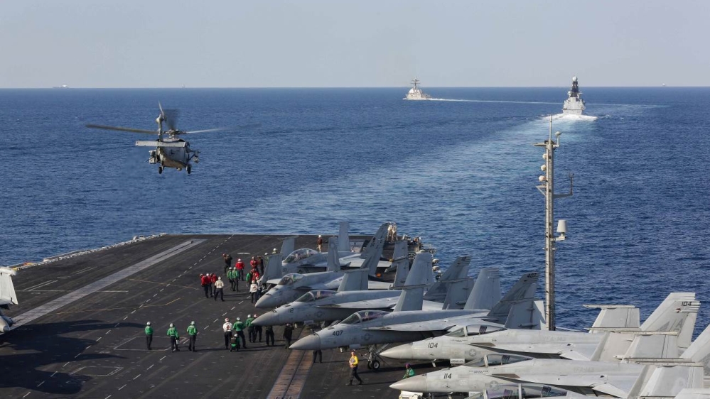 A MH-60S Sea Hawk helicopter from the "Nightdippers" of Helicopter Sea Combat Squadron 5 lifts off from the flight deck of he aircraft carrier