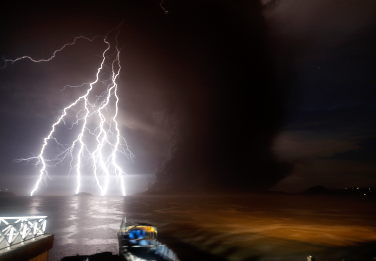 A view of a lightning strike over Taal Volcano during an eruption, in Talisay, Batangas, Philippines, 12 January 2020. Thousands of people have been ordered to evacuate as the authorities in the Phili