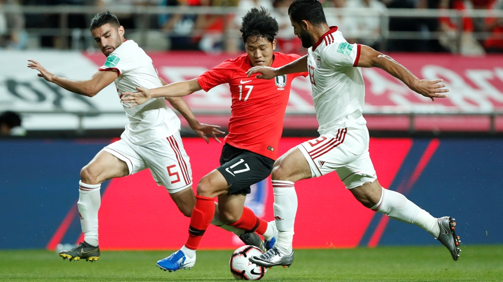 Soccer Football - International Friendly - South Korea v Iran - Seoul World Cup Stadium, Seoul, South Korea - June 11, 2019 South Korea''s Sang-Ho Na in action with Iran''s Hossein Kanaani and