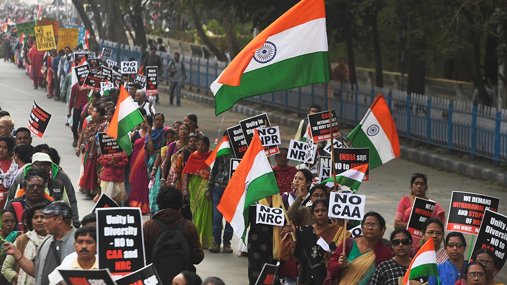Members of the Christian community along with social activists hold placards and Indian flags as they take part in a rally to protests against the Indian government''s Citizenship Amendment Act (CAA),
