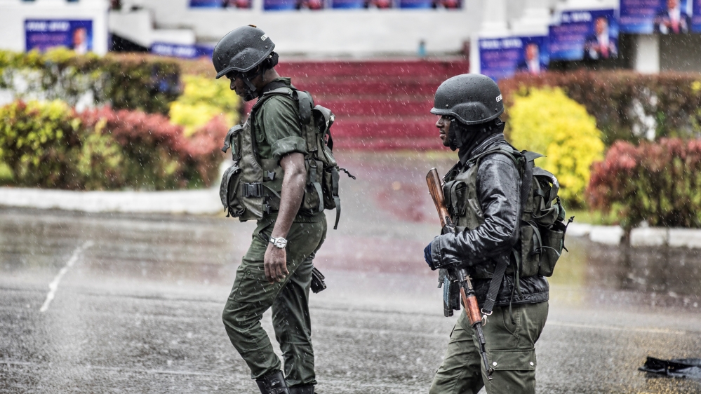Members of the Cameroonian Gendarmerie patrols in the Omar Bongo Square of Cameroon''s majority anglophone South West province capital Buea on October 3, 2018 during a political rally of the ruling CPD