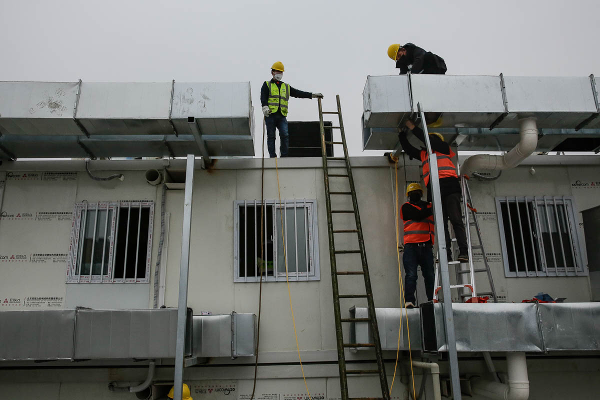 WUHAN, CHINA - FEBRUARY 03: Workers build hospital on February 3, 2020 in Wuhan, China. After only 10 days of construction, Wuhan Huoshenshan Hospital was officially completed and delivered, and on Fe